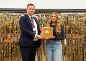 1 Belle Phillips receives the work experience student of the year shield from Lawrence Wood of Telford College