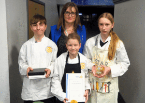 Angela Summerfield with George Lough, Tilly Rhodes, and winner Eleanor McGuire