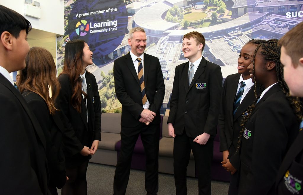 Daniel Roycroft with HLC secondary school students